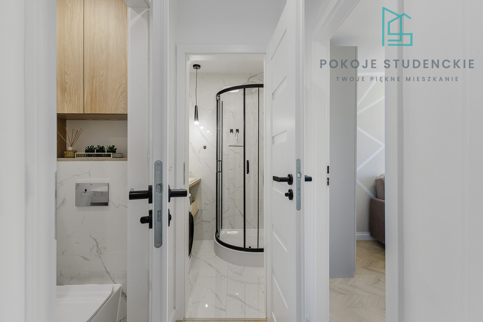 Open doors reveal a modern hallway leading into a marble bathroom with a curved glass shower enclosure.